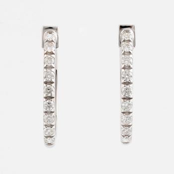 Brilliant cut diamond hoop earrings.