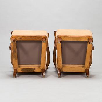 A pair of 1950s armchairs.