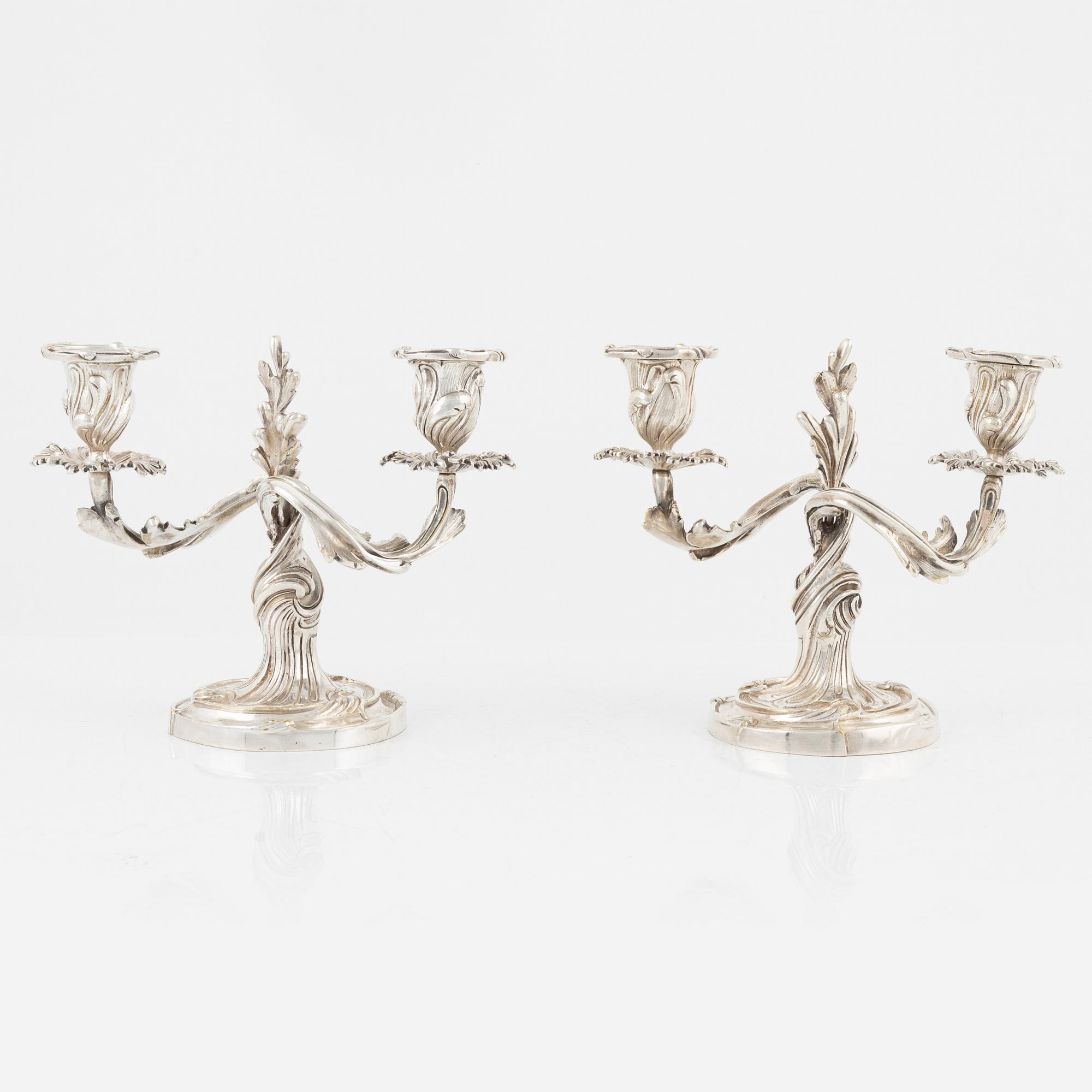 A rococo style pair of silverplated candelabras, end of the 19th Century..