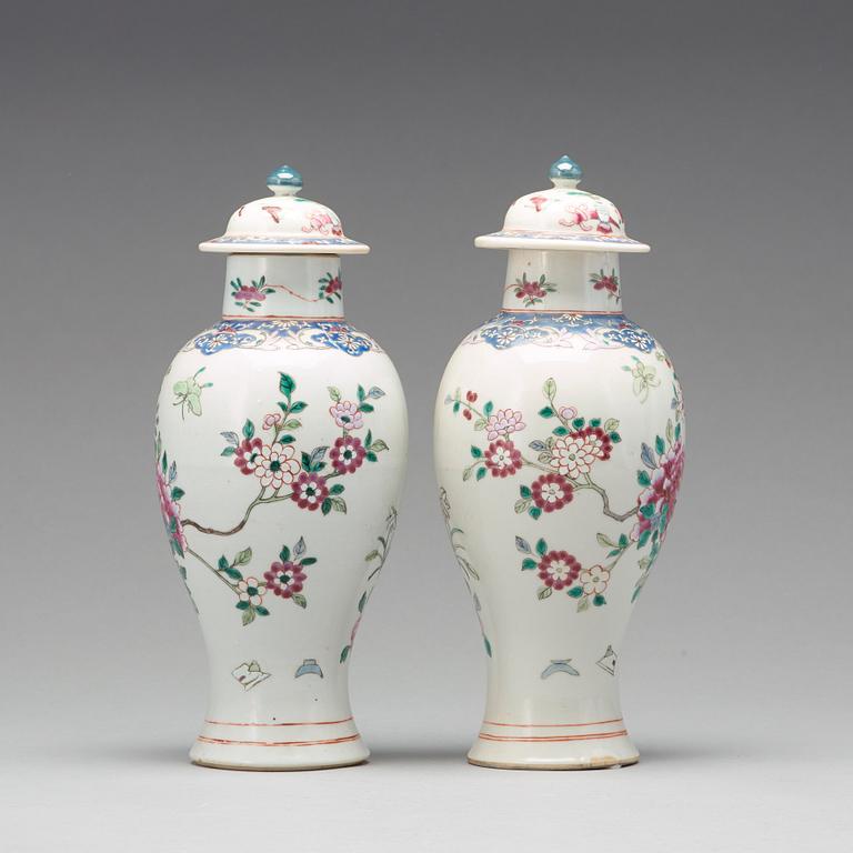 A pair of famille rose vases with covers, Qing dynasty, Qianlong (1736-95).