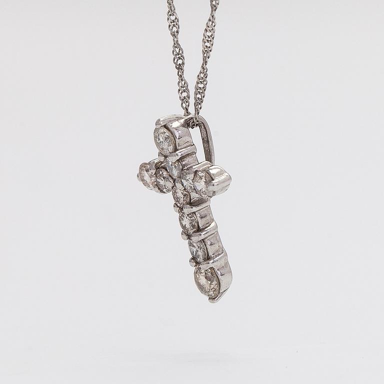 A platinum necklace with a cross pendant set with brilliant-cut diamonds 0.50 ct acording to engraving.