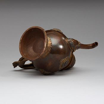 An copper alloy teapot with silver inlays, Tibet 19th Century.