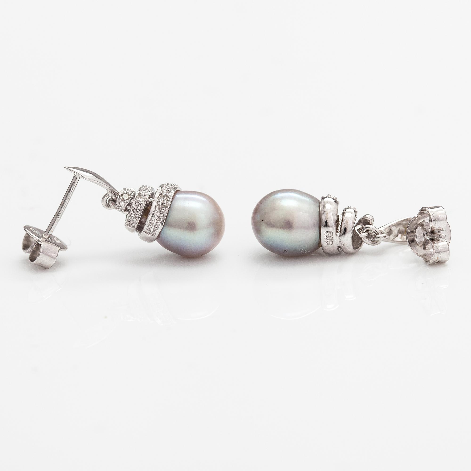 A pair of 14K white gold earrings with cultured pearls and diamonds ca. 0.06 ct in total. Caratia, Helsinki 2001.