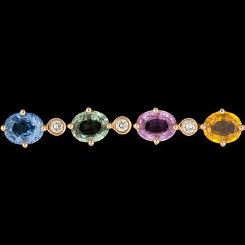A multi-coloured sapphire and diamond bracelet. Total carat weight of sapphires circa 9.35 cts.