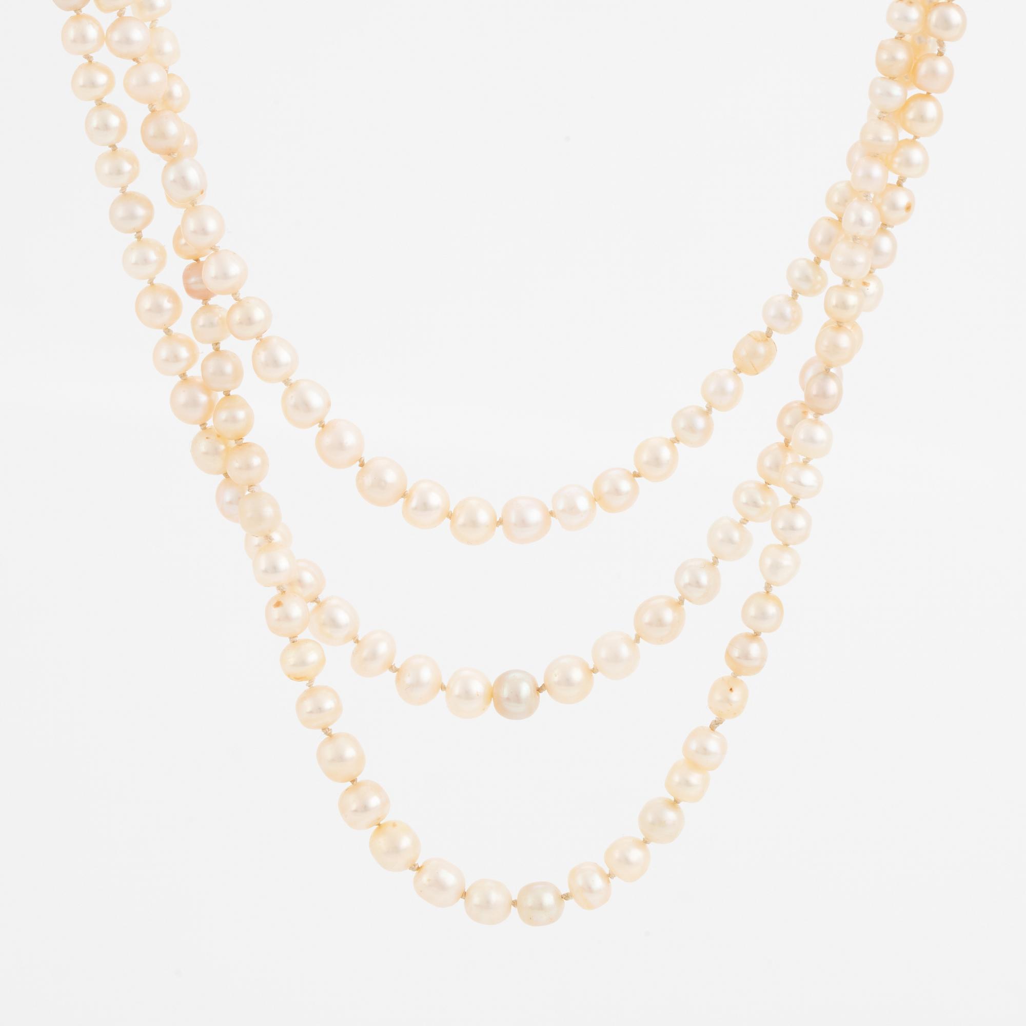 Three strand pearl necklace, clasp with cabochon cut sapphire.