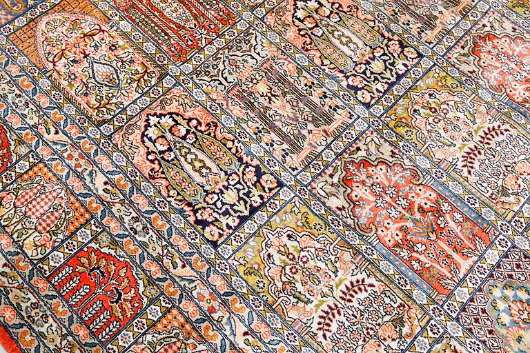 A Kashmir silk carpet, c. 434 x 307 cm.