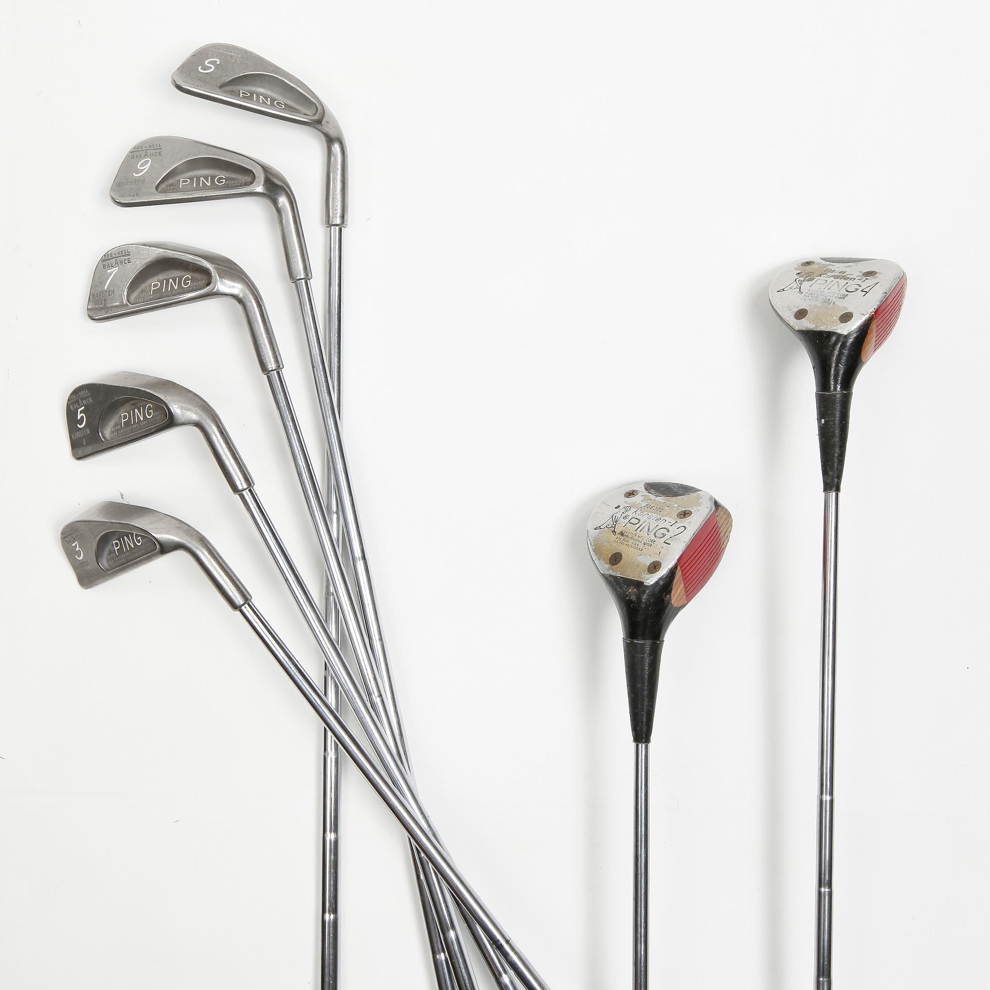 MULBERRY, a green leather golf bag with golf clubs.