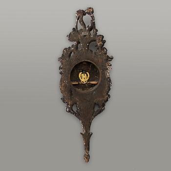 A 18th century wall clock.