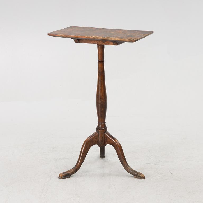 A folding table, early 19th century.