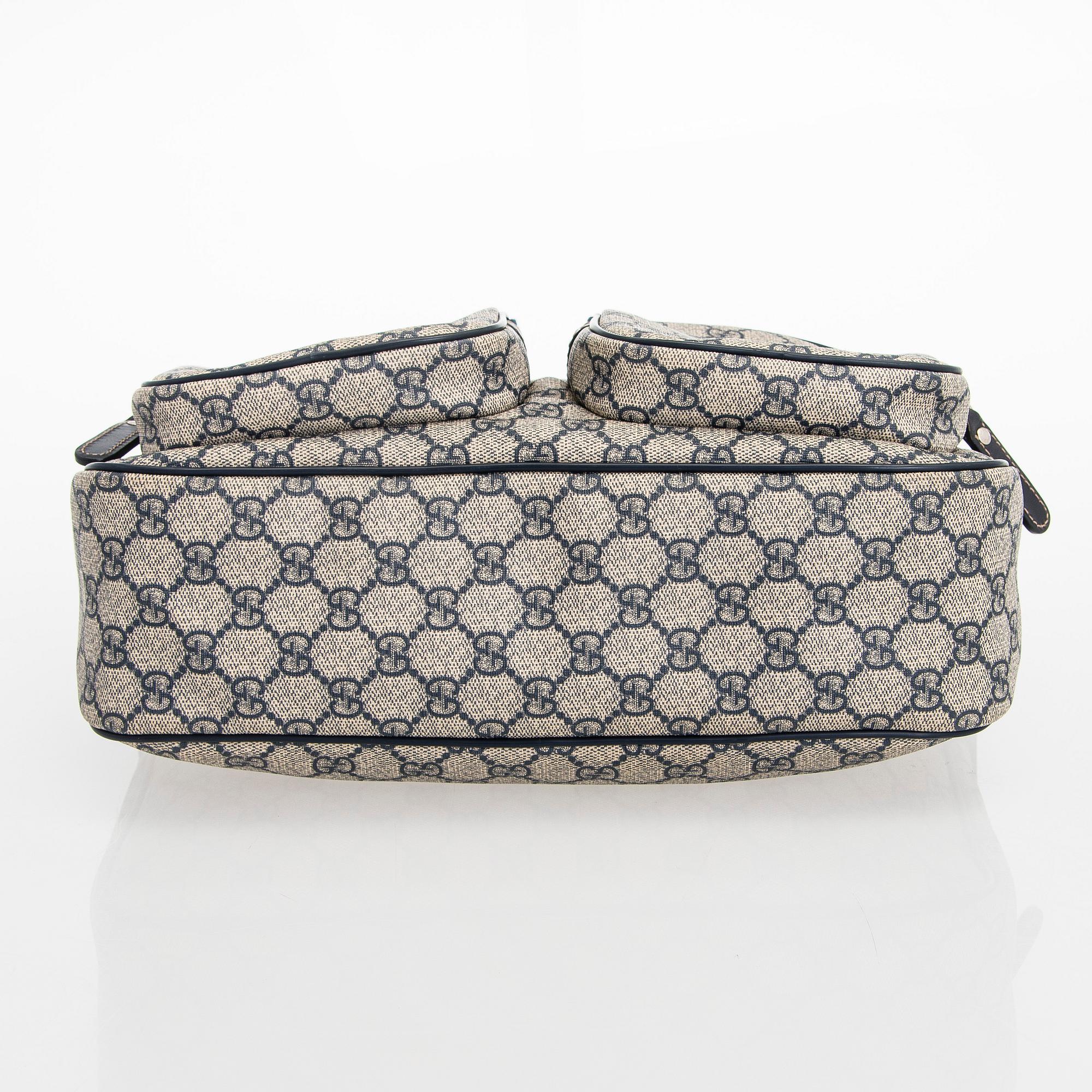 Gucci, A "GG Supreme messenger" bag.