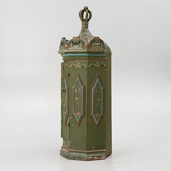 Corner cabinet, likely 18th century.