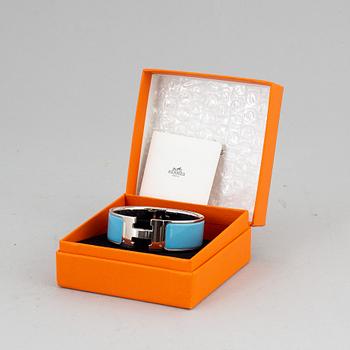 HERMÈS, a 'Clic H' bangle.