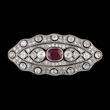 86. A circa 1.75 ct ruby and old-cut diamond, circa 2.50 cts in total, brooch.