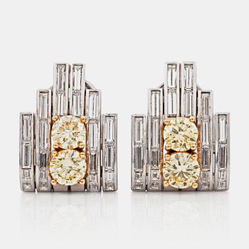 A pair of Paul Binder Fancy Yellow diamond earrings. Total carat weight of fancy diamonds circa 1.80 cts,