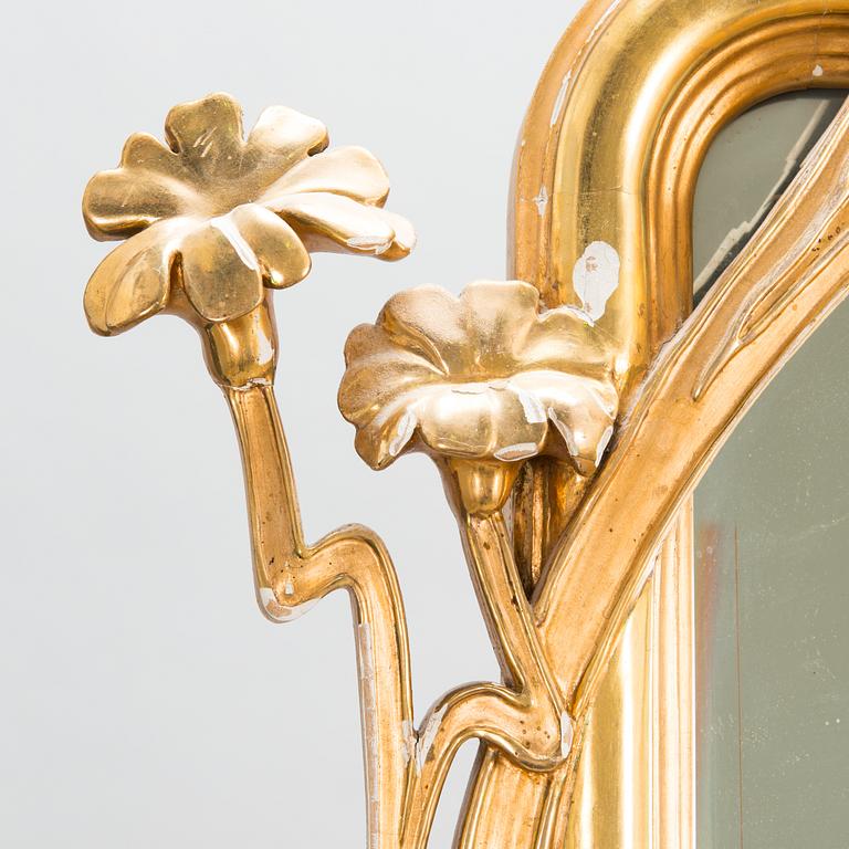 An Art Nouveau mirror with console table from early 20th century.