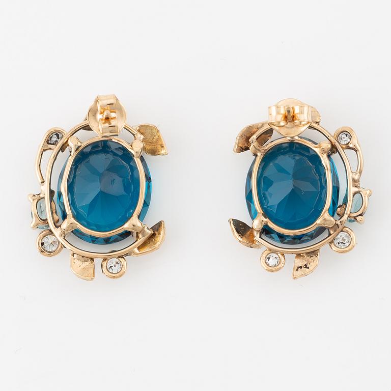 Earrings with blue topazes and brilliant-cut diamonds.