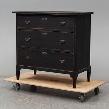 a chest of drawers from the first half of the 20th century.