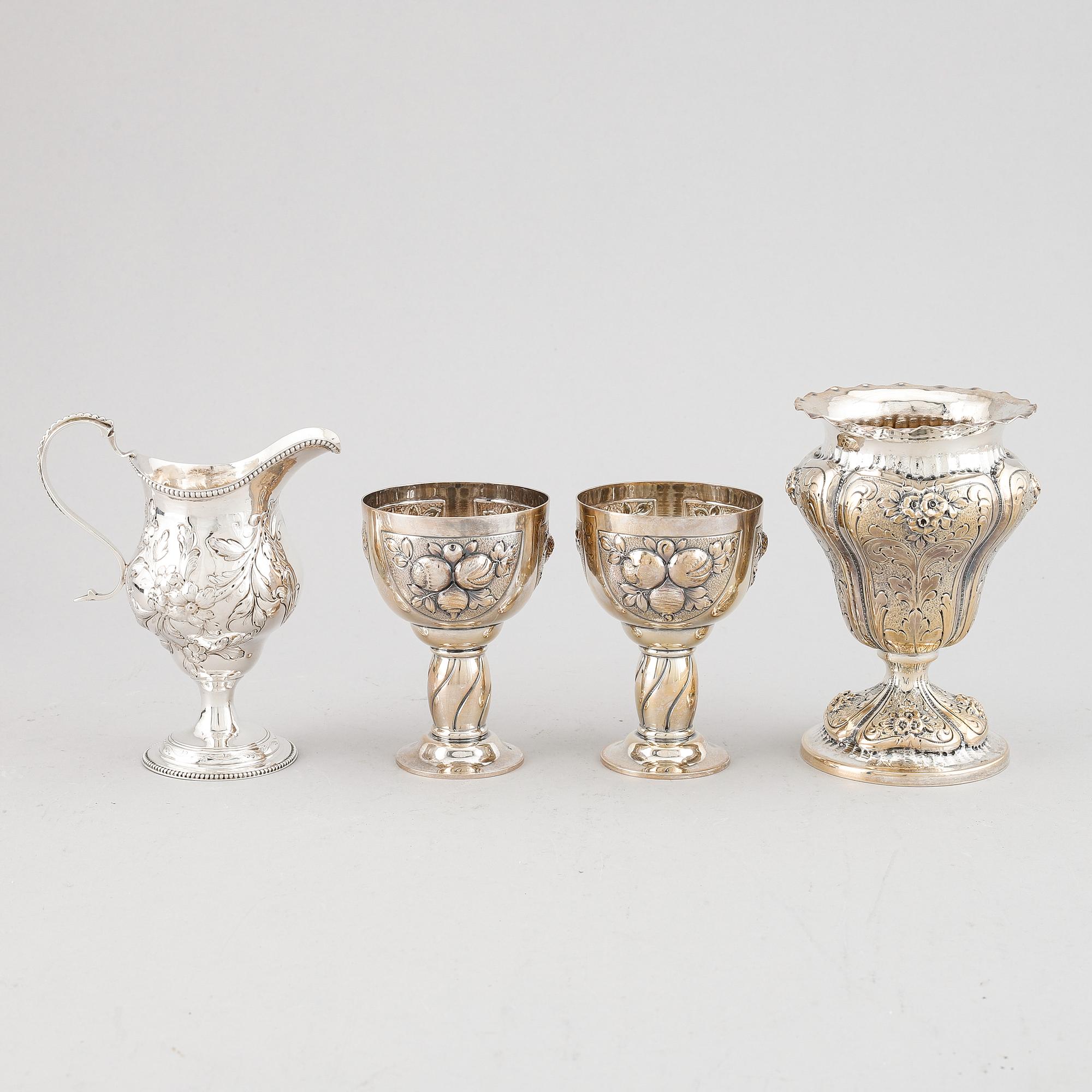 A mixed lot of two beakers, a vase and a jug, Baroque style, silver 830, 20th century.