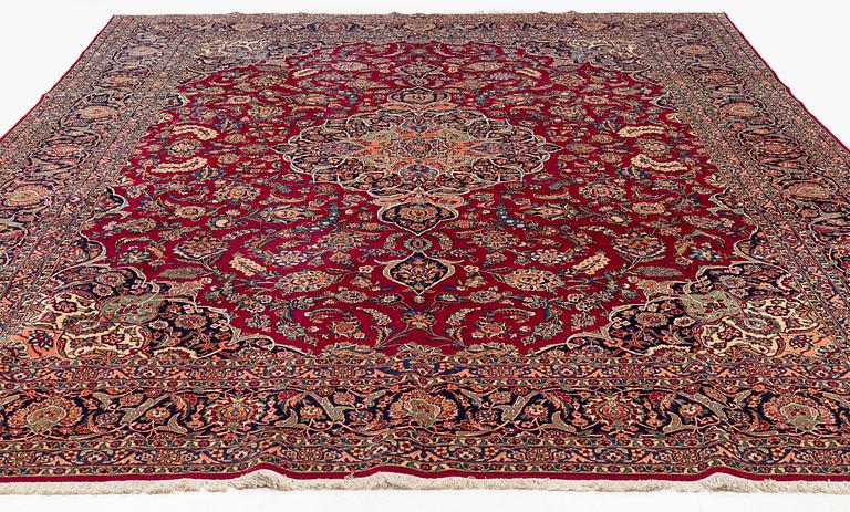 A semi-antique Kashan carpet, c 435 x 325 cm.