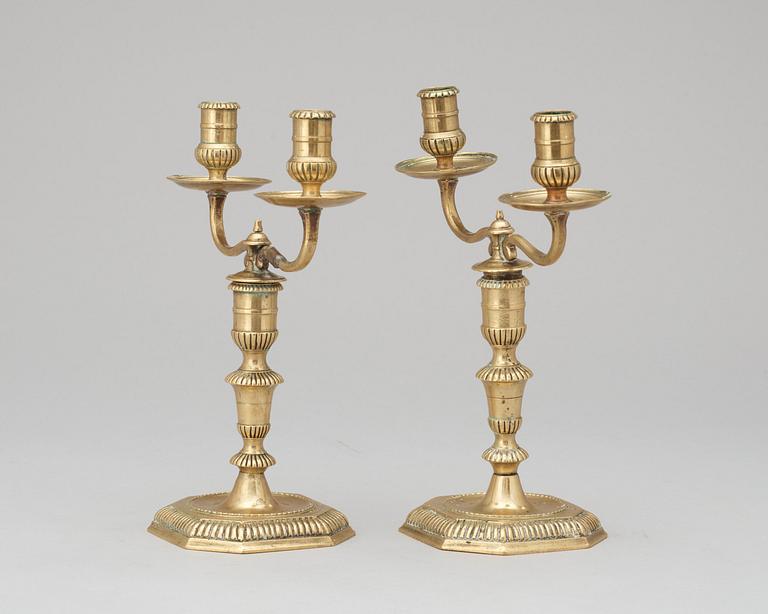 A pair of Swedish Baroque early 18th century bronze two-light candelabra.