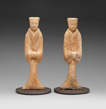 581. A pair of potted tomb figures of a guardiens, Han dynasty (206 B.C. - 220 A.D.).