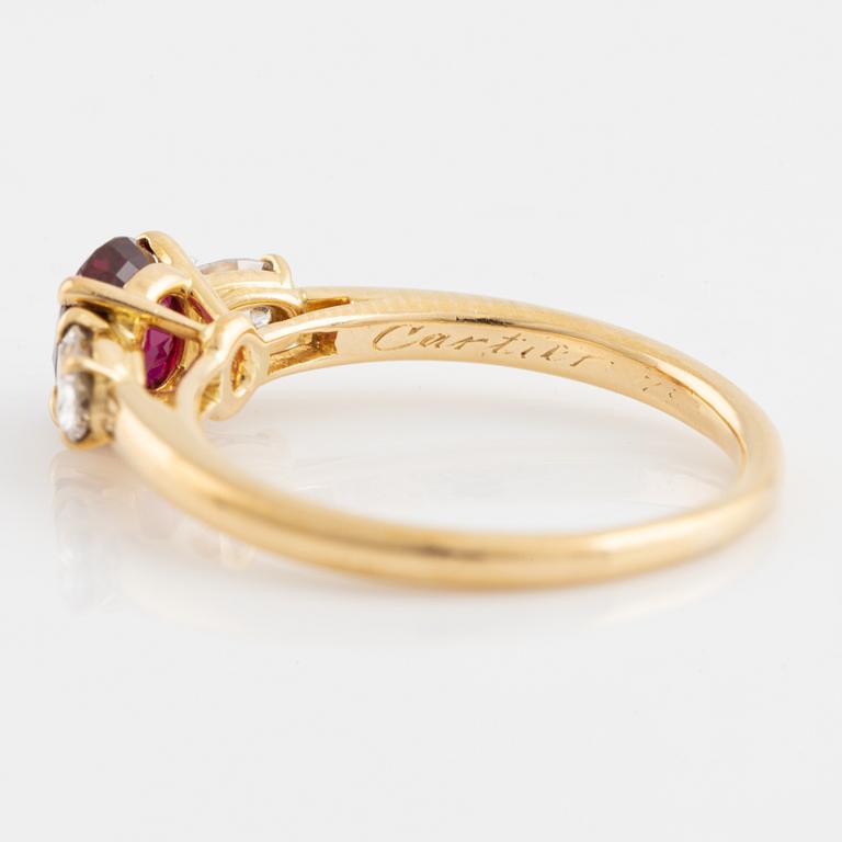 Cartier, A Cartier oval ruby and diamond ring.