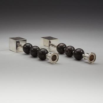 Sigurd Persson, a pair of silver plated and porphyry candlesticks, Sweden.