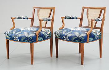 A pair of Josef Frank mahogany and ratten armchairs, Svenskt Tenn,