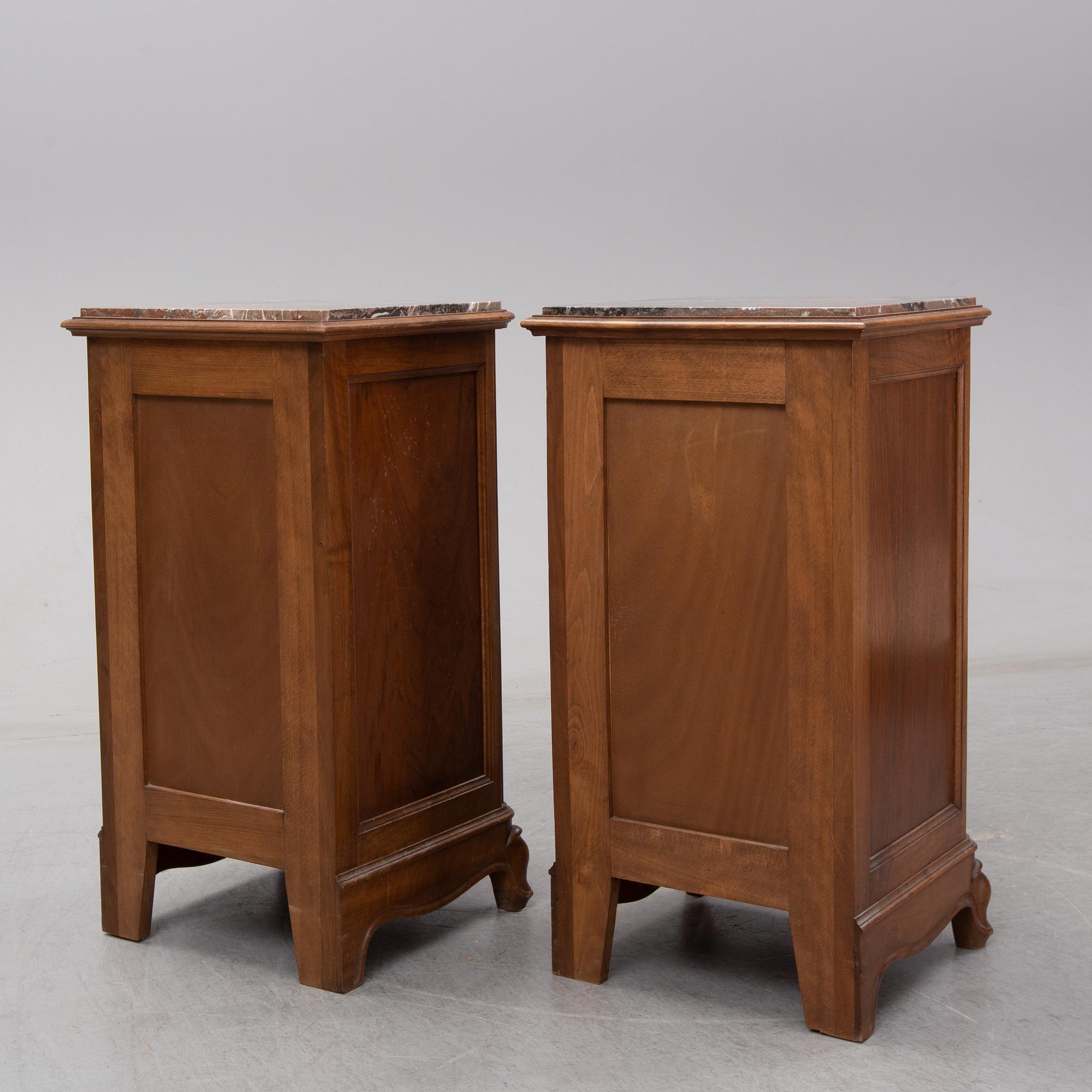 A pair of walnut marble top bedside tables, first half of the 20th Century.