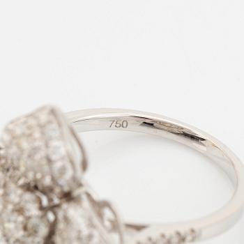 Brilliant cut diamond flower ring.