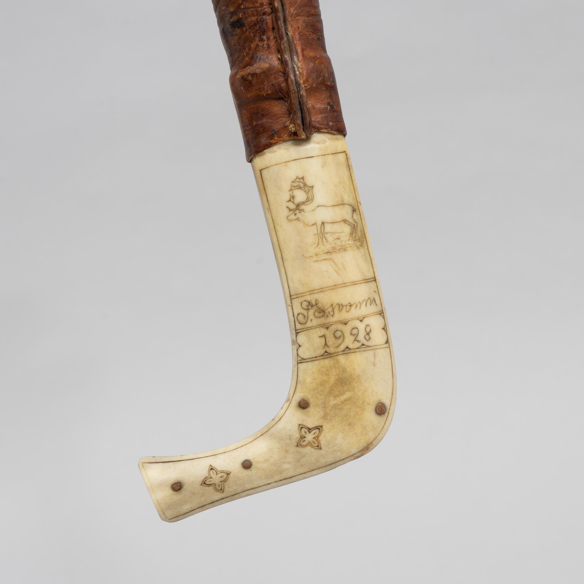 Per Erik Svonni, a reindeer horn knife, signed and dated 1928.