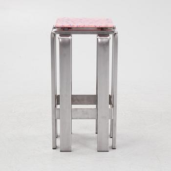 Stamuli, Stamuli & Alessandro Bruzzone, a stool, Greenhouse Bar for Stockholm Furniture Fair 2024. Frame in bent steel, seat in recycled plastic, stamp-signe...