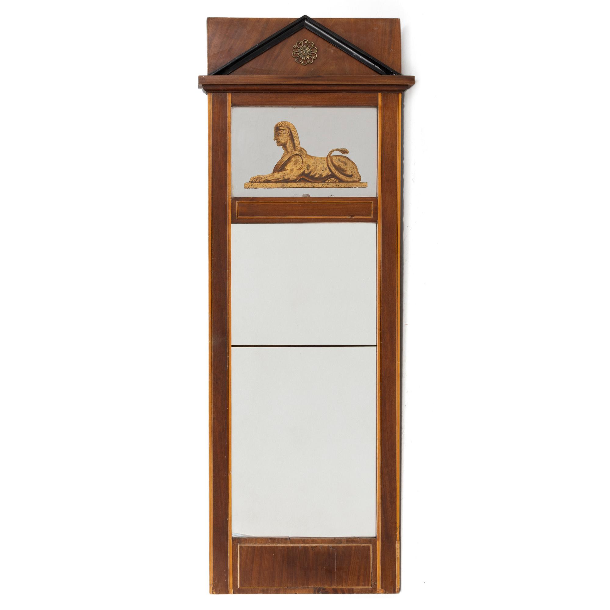 An Empire style mirror, second half of the 20th century.