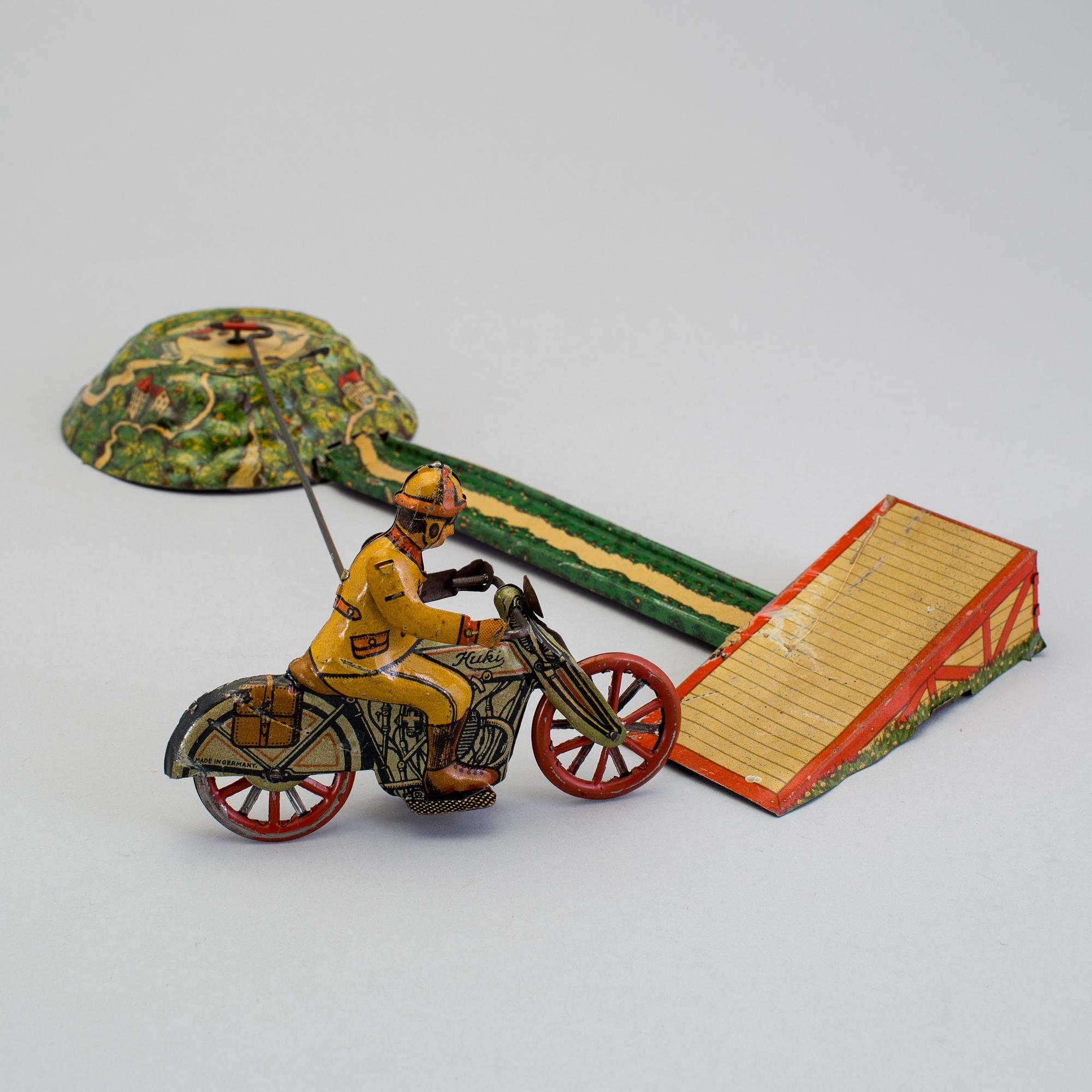 A tinplate Huki roundabout motorcycle, Germany, 1930s.