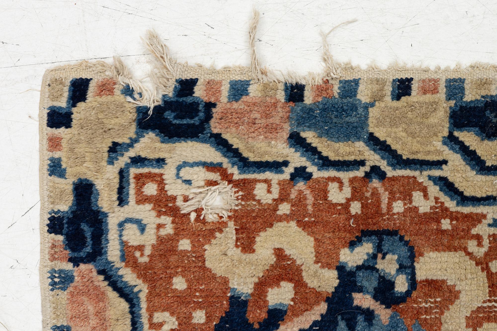 Two Chinese carpet fragments, late Qing dynasty.