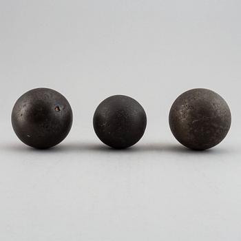 Three iron balls, 18th/19th century.