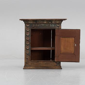 A Swedish provincial wall hanging cabinet, 1833.