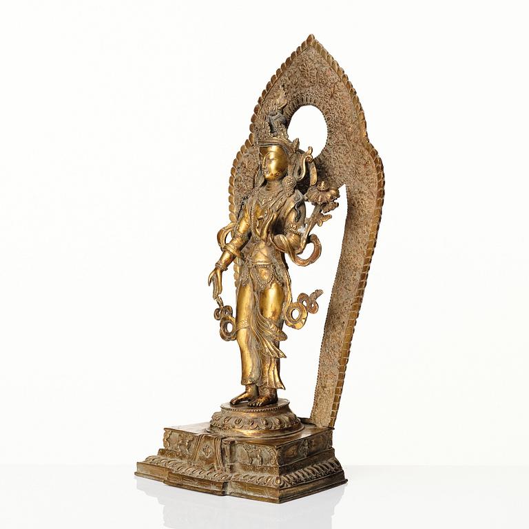 A gilt copper-alloy figure of Boddhisatva Avalokiteshvara, Nepal, 20th century.