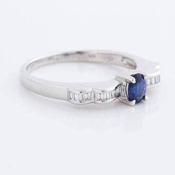 A sapphire and baguette cut diamond ring.