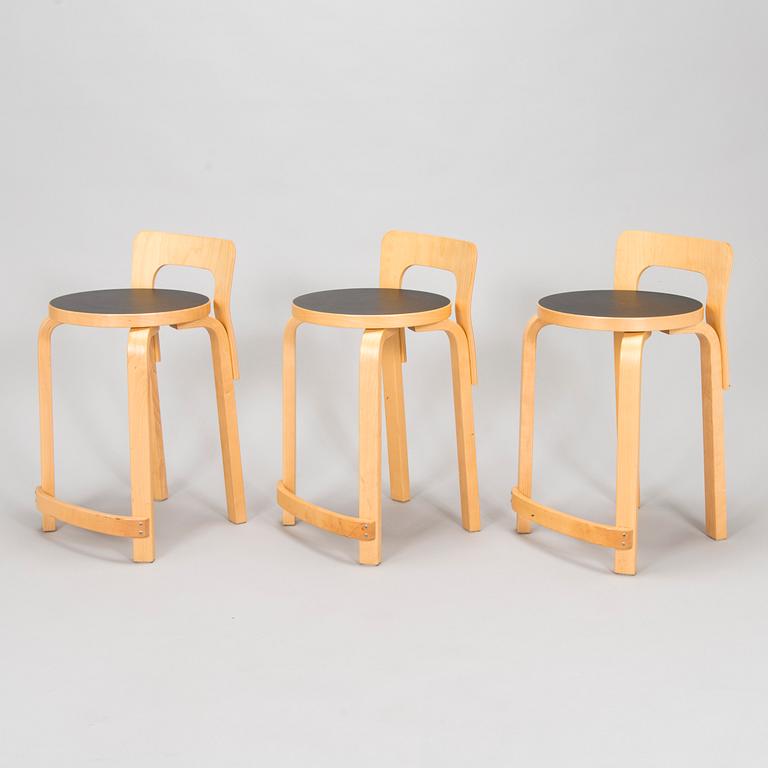 Alvar Aalto, a table and three chairs, Artek 2006 and 2007.