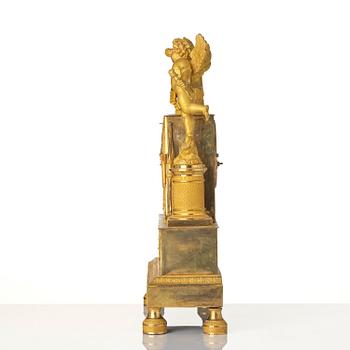 A French Empire ormolu figural mantel clock, early 19th century.