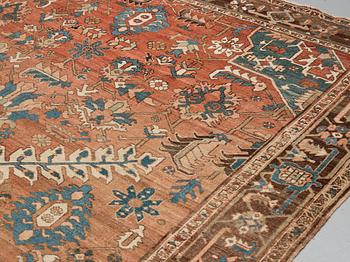 A carpet, an antique Heriz, ca 454,5-460,5 x 268-285 cm.