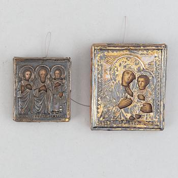 Two Russian 19th century travle icon, oklad in silver and parce-gilt, one with assayer mark AA 1890.