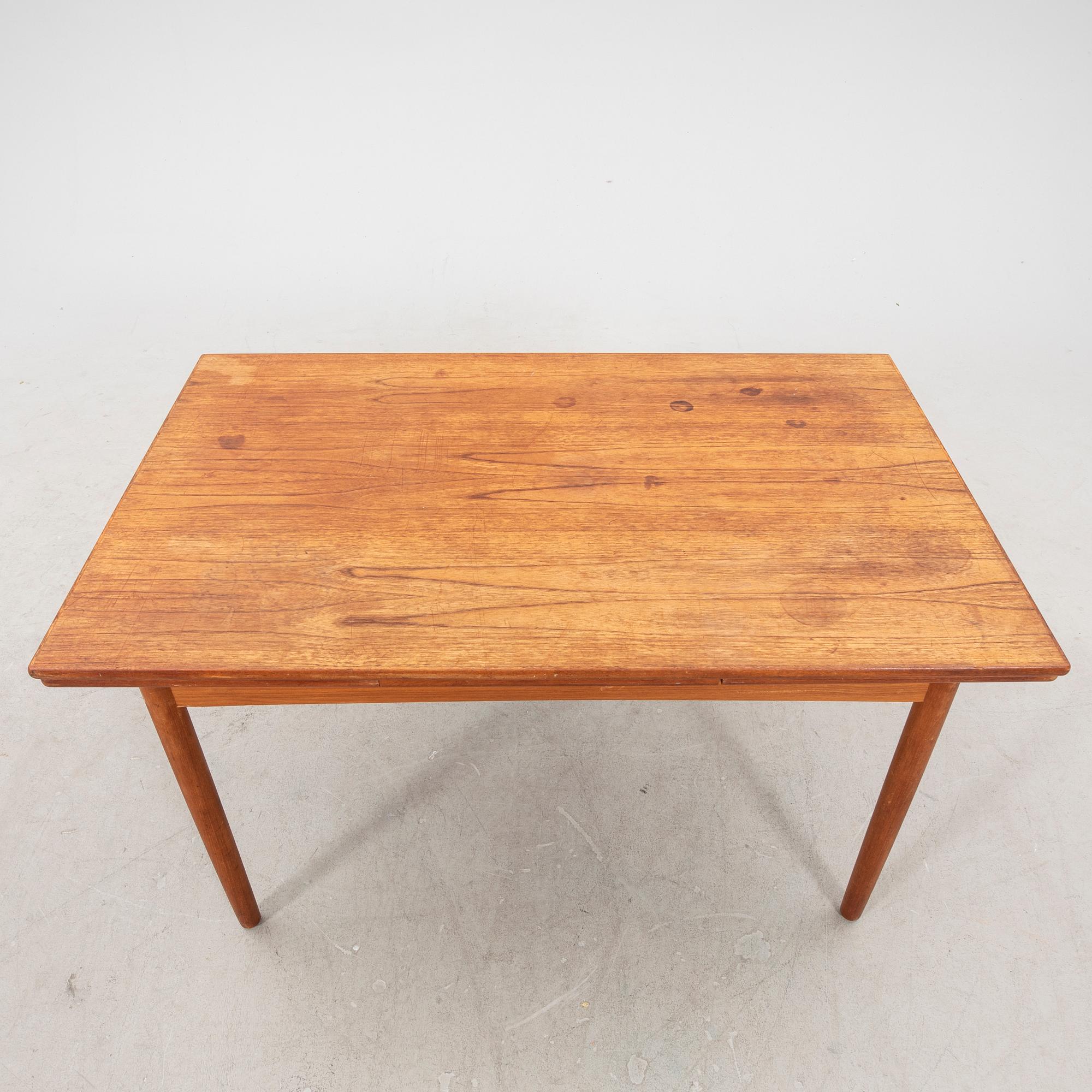 A 1960s teak dining table.