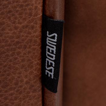 A 'Stepp' easy chair width stool by Carl-Henric Spak for Swedese.