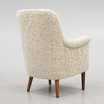 Carl Malmsten, a "Husmor" armchair, O.H.Sjögren, Tranås, 1984.