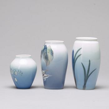 BING & GRÖNDAHL and ROYAL COPENHAGEN, a set of three porcelain vases and a dish, Denmark.