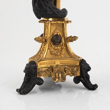 A pair of five-branch gilt and patinated bronze figural candelabra, later part of the 19th century.