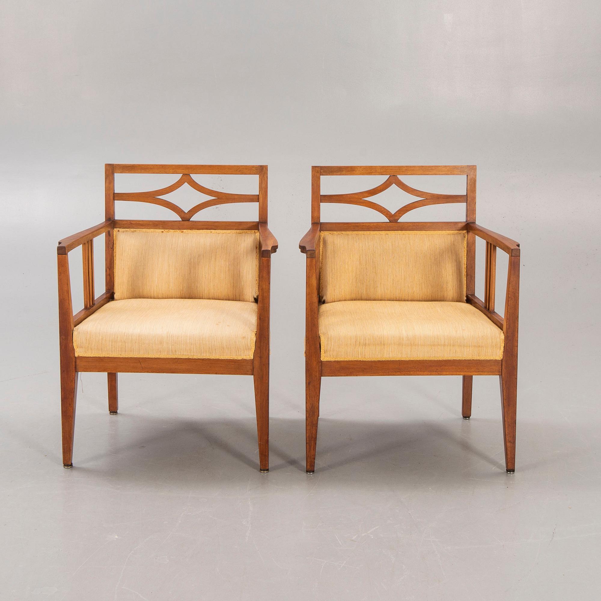 A pair of armchairs around 1900.