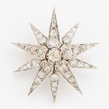 Brooch/pendant, in the shape of a star, silver and gold with old-cut diamonds.